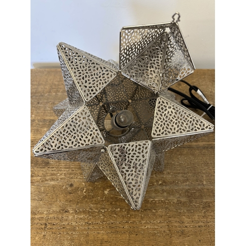 250 - A white metal star lamp, approx. 11