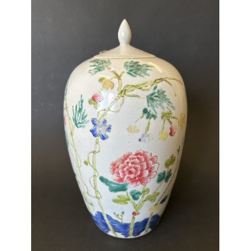 252 - An antique Chinese hand painted lidded vase, it still has a paper seal in place and contains somethi... 