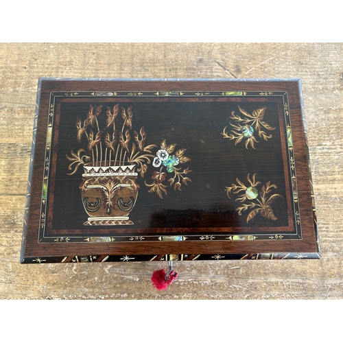 257 - An antique wood writing/stationery slope/box, the lid inset with mother of pearl with painted plant ... 