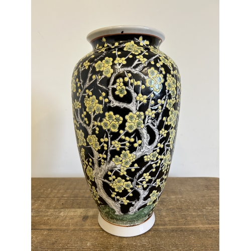 265 - A large vintage Oriental style vase decorated with prunus root and blossom, approx. 15