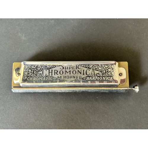 27 - A boxed vintage 'The Super Chromonica Harmonica' by M Hohner (box as found)