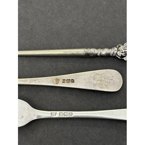 282 - A Sheffield hallmarked silver childs spoon and fork plus a silver handled button hook