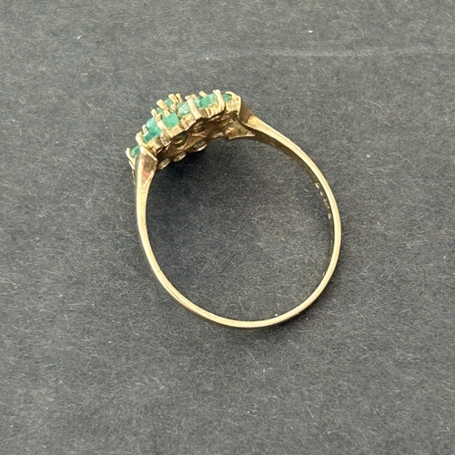 291 - A 9ct gold and emerald daisy cluster ring, approx. size Q, weight approx. 1.9g