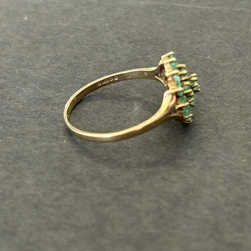 291 - A 9ct gold and emerald daisy cluster ring, approx. size Q, weight approx. 1.9g