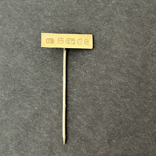 292 - A 9ct gold pin plus a yellow metal stick pin with golf ball top, marked 15ct and a yellow metal and ... 