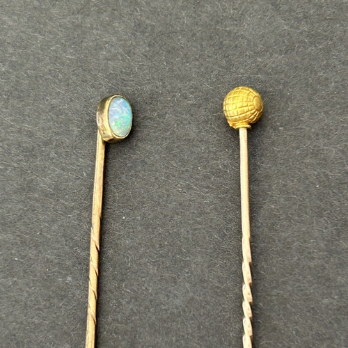 292 - A 9ct gold pin plus a yellow metal stick pin with golf ball top, marked 15ct and a yellow metal and ... 