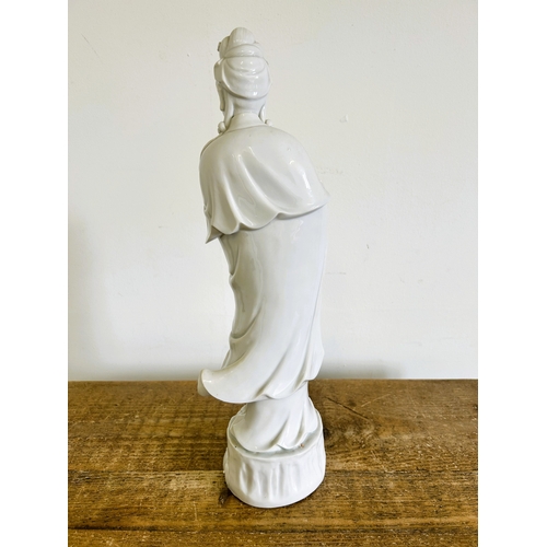 30 - An Oriental Blanc-de-Chine style figurine, 17