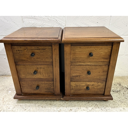 390 - A pair of vintage solid wood bedside chests of three drawers, approx. 24 1/4