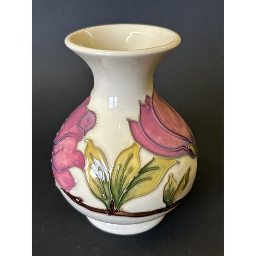 43 - A vintage Moorcroft vase in the 'Magnolia' pattern, approx. 5