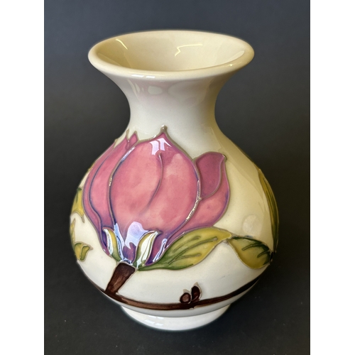 43 - A vintage Moorcroft vase in the 'Magnolia' pattern, approx. 5