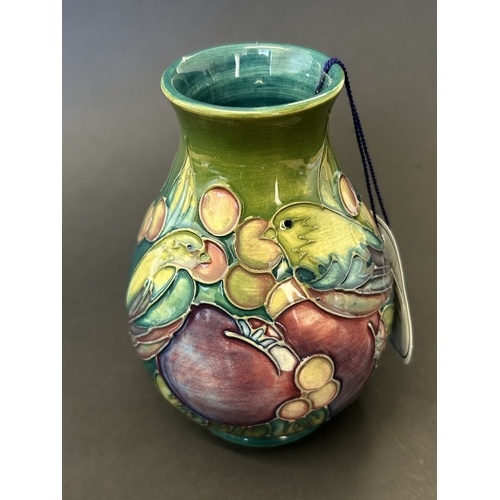 44 - A Moorcroft vase in the 'Finches Teal' pattern, designed by Sally Tuffin, circa 1990's , approx. 5 1... 