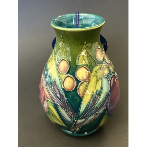 44 - A Moorcroft vase in the 'Finches Teal' pattern, designed by Sally Tuffin, circa 1990's , approx. 5 1... 