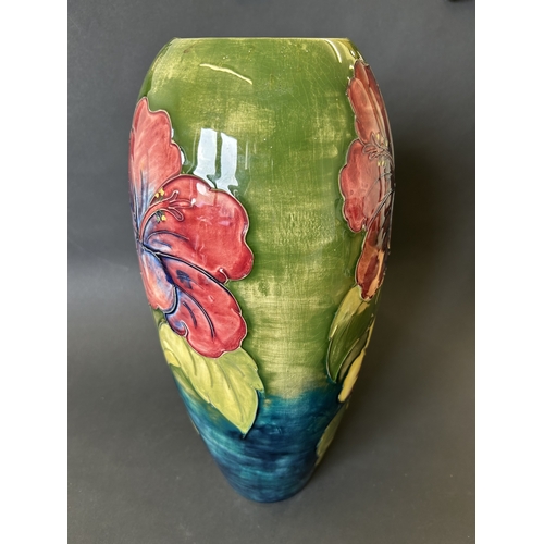 52 - A vintage Moorcroft vase in the 'Hibiscus' pattern, with pink By Appointment to the Late Queen Mary ... 