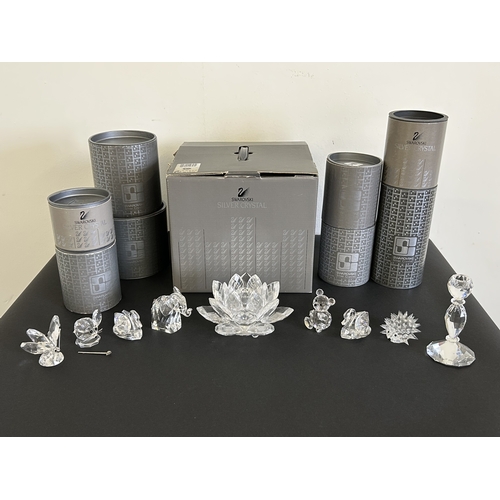 56 - Nine boxed Swarovski ornaments to include a water lily lotus candleholder, butterfly, mouse (as foun... 