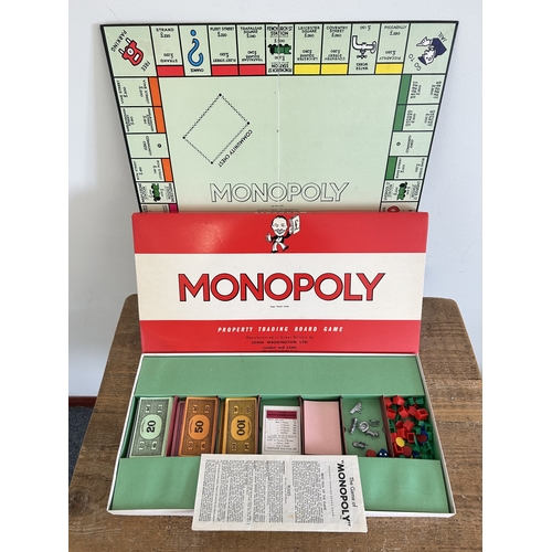 71 - Boxed Monopoly and Trivial Pursuits games plus a boxed Atlas Editions 'Flying Scotsman'