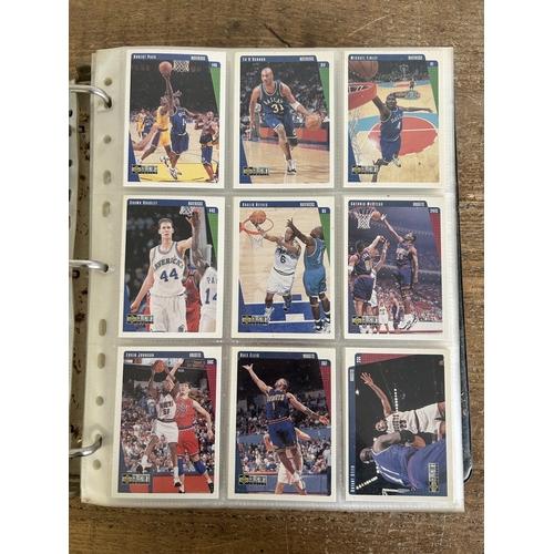 89 - An extensive collection of Upper Deck NBA trading cards in a grey folder