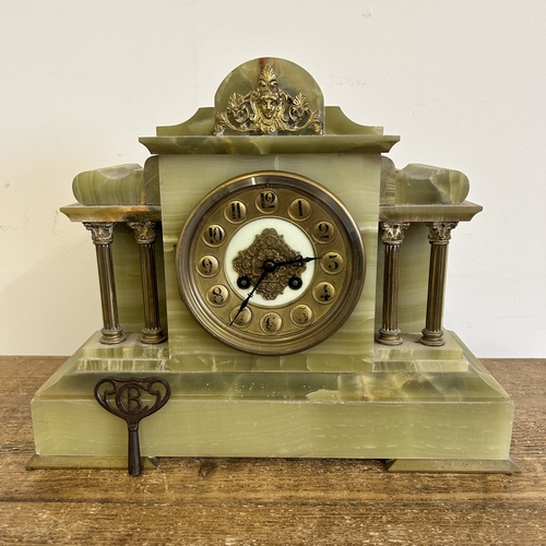 An antique onyx cased chiming mantel clock, Paris made and retailed in ...