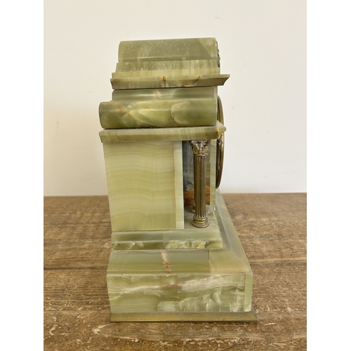 An antique onyx cased chiming mantel clock, Paris made and retailed in ...