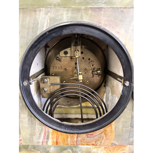 An antique onyx cased chiming mantel clock, Paris made and retailed in ...