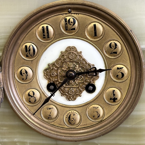 An antique onyx cased chiming mantel clock, Paris made and retailed in ...
