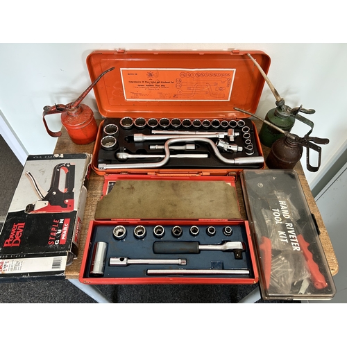 Two sets of socket sets, three vintage oil cans, a power Devil staple ...