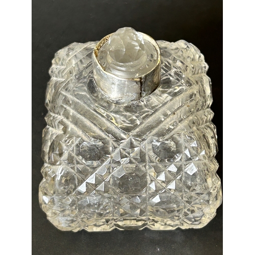 101 - A hallmarked silver and cut glass perfume bottle with internal stopper, approx. 4 1/4