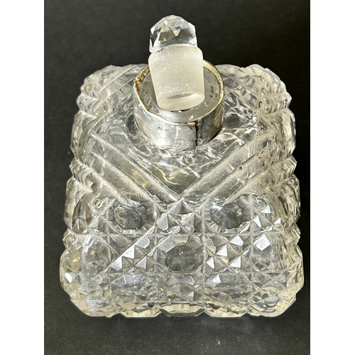 101 - A hallmarked silver and cut glass perfume bottle with internal stopper, approx. 4 1/4