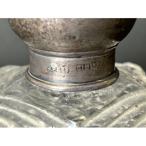 101 - A hallmarked silver and cut glass perfume bottle with internal stopper, approx. 4 1/4
