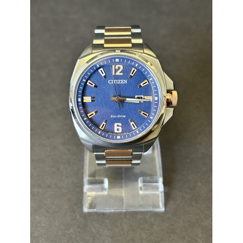 103 - A gentlemans Citizen Eco-Drive two tone blue dial wristwatch, boxed with certificate etc (runs and t... 