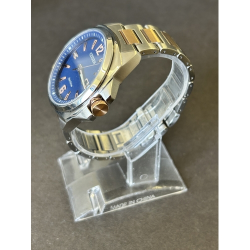 103 - A gentlemans Citizen Eco-Drive two tone blue dial wristwatch, boxed with certificate etc (runs and t... 