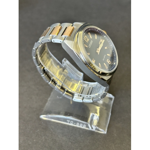 103 - A gentlemans Citizen Eco-Drive two tone blue dial wristwatch, boxed with certificate etc (runs and t... 