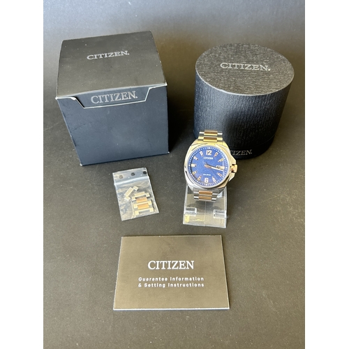 103 - A gentlemans Citizen Eco-Drive two tone blue dial wristwatch, boxed with certificate etc (runs and t... 