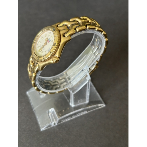 110 - A ladies Tag Heuer WG1330-2 wristwatch, 28mm dia (runs and ticks)