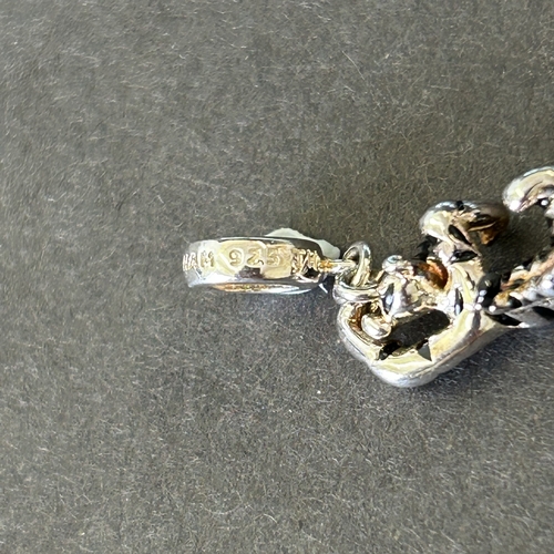 118 - Three small 925 sterling silver 'Chamilia' Disney charms, Minnie Mouse, Eeyore and Tigger