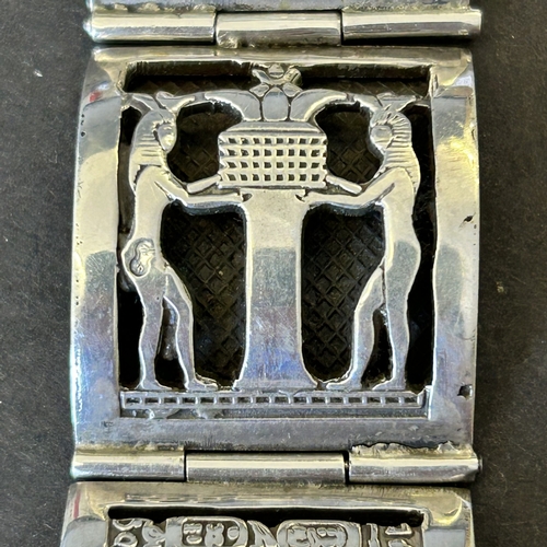127 - An Egyptian white metal bracelet, is does bear stamp marks on three of the sections, weight approx. ... 