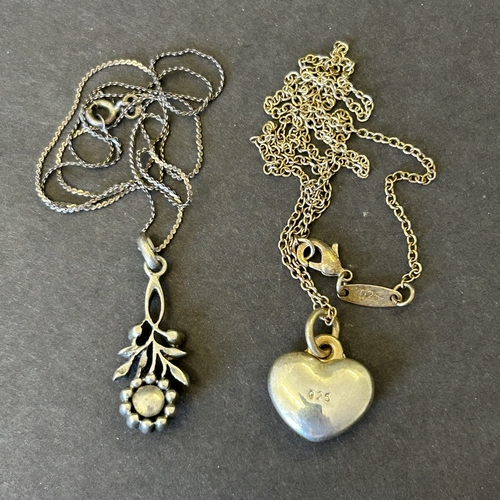 130 - An 830 grade silver pendant with white stones plus a 925 sterling silver heart pendant
