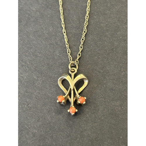 140 - A 9ct gold and orange stone set pendant and chain, total weight approx. 1.9g (the chain has an as fo... 