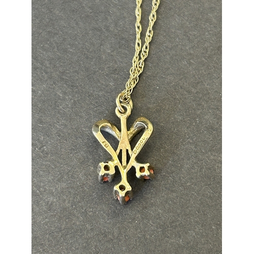 140 - A 9ct gold and orange stone set pendant and chain, total weight approx. 1.9g (the chain has an as fo... 