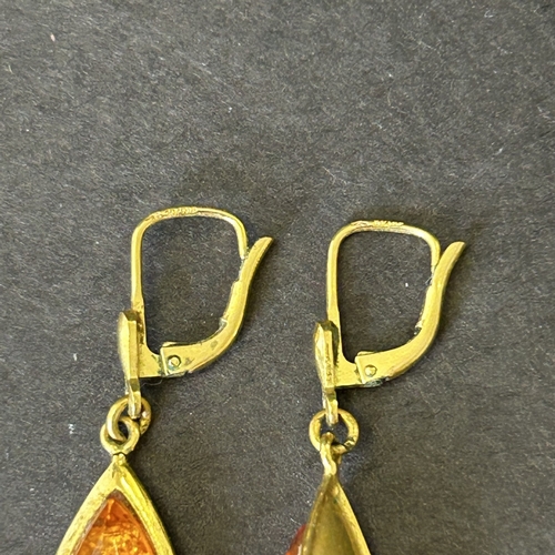 156 - A pair of yellow metal and amber style earrings, bears mark on top of wires, total weight approx. 4g