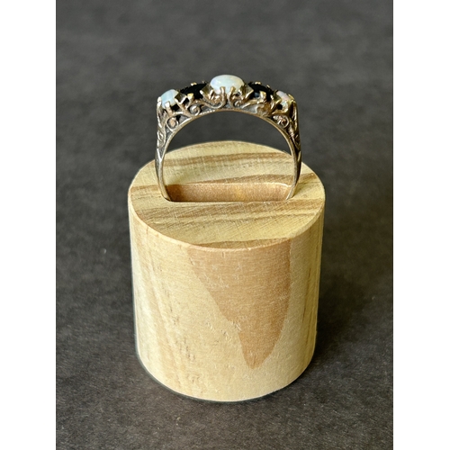 172 - A 9ct gold opal and dark stone ring, approx. size T, weight approx. 3.5g