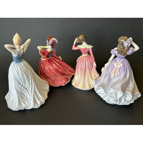 39 - Four Royal Doulton figurines to include 'Bells Across the Valley' HN4300, 'Finishing Touch' HN4329, ... 