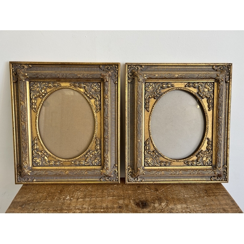 402 - A pair of vintage gilded wood and glazed photograph or picture frames, frame size 14