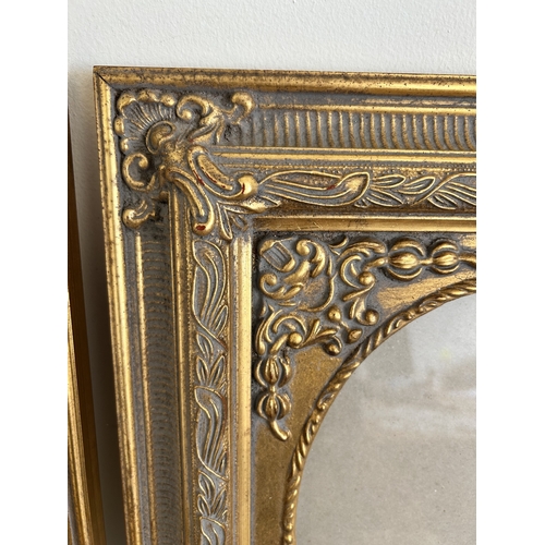 402 - A pair of vintage gilded wood and glazed photograph or picture frames, frame size 14