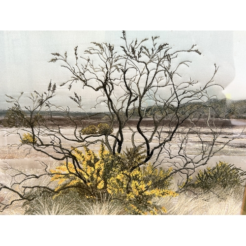 417 - A framed and glazed silk work picture of a tree in a landscape, initialled J D, 17