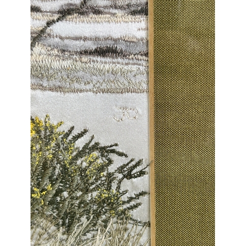 417 - A framed and glazed silk work picture of a tree in a landscape, initialled J D, 17