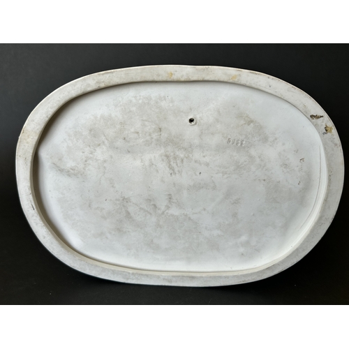 82 - A vintage Dresden porcelain lacework recumbent female figurine, bears a blue crown mark to the back,... 