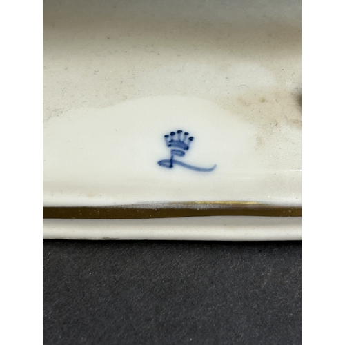 82 - A vintage Dresden porcelain lacework recumbent female figurine, bears a blue crown mark to the back,... 