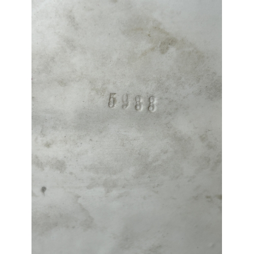 82 - A vintage Dresden porcelain lacework recumbent female figurine, bears a blue crown mark to the back,... 