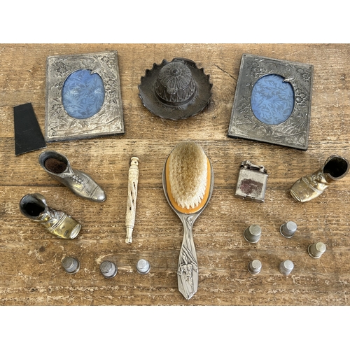 85 - A pair of white metal bird decorated photo frames, approx. 6