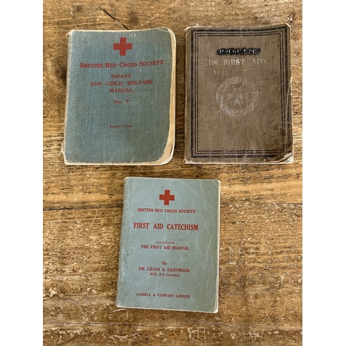 91 - A selection of vintage postcards and Red Cross First Aid books